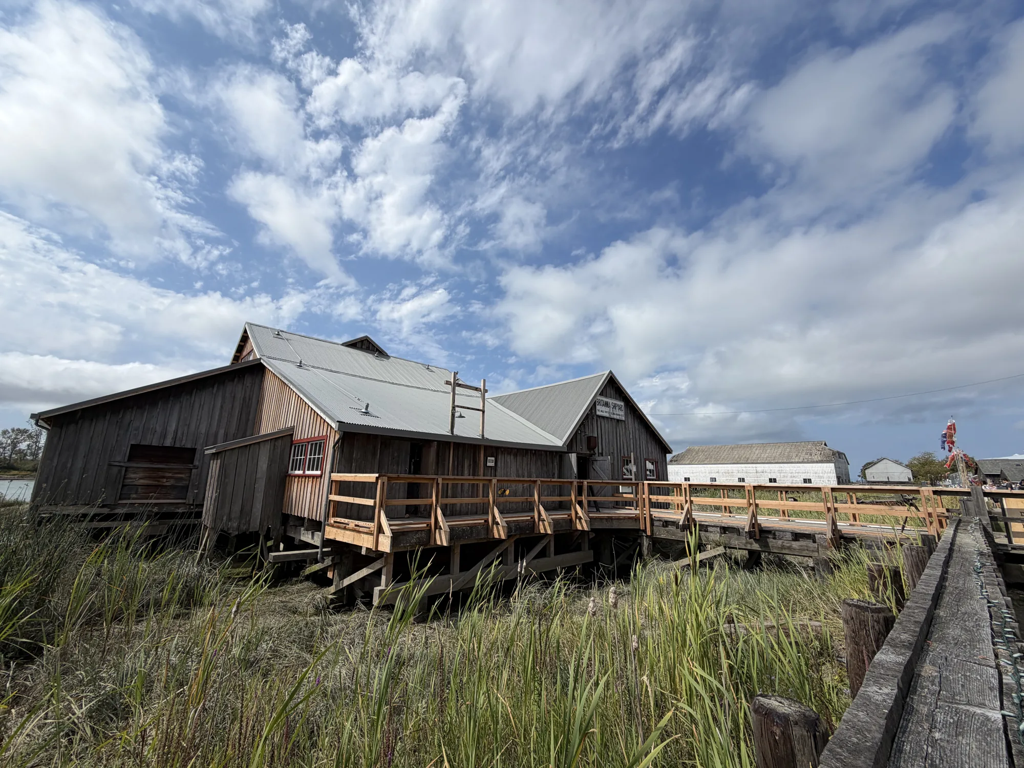 Britannia Shipyards buildings beneath a wide blue sky.